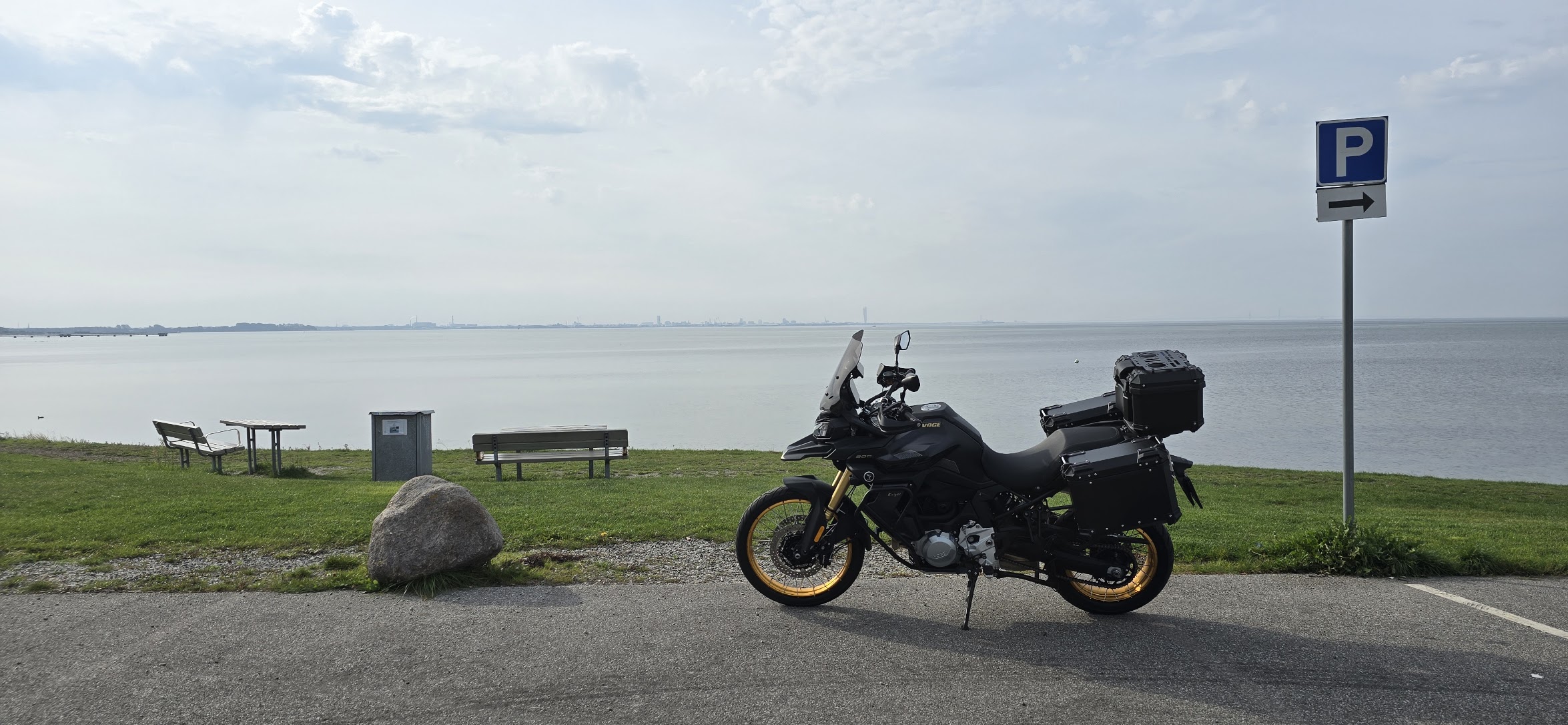 DS900X parked with a view over the sea on the ride home